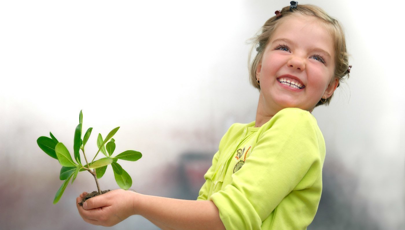 girl with plant learning classical education through scholé academy homeschool